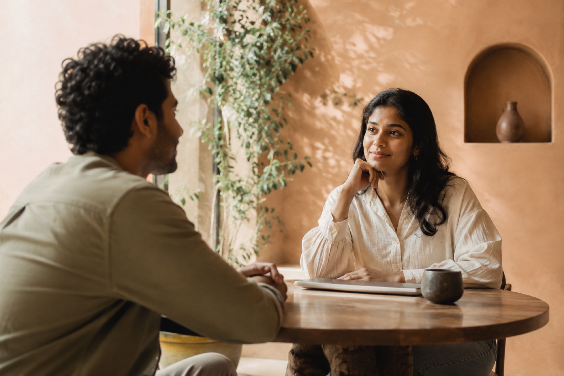 A warm one-to-one conversation in soft daylight
